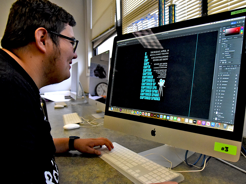Student working on graphic design project