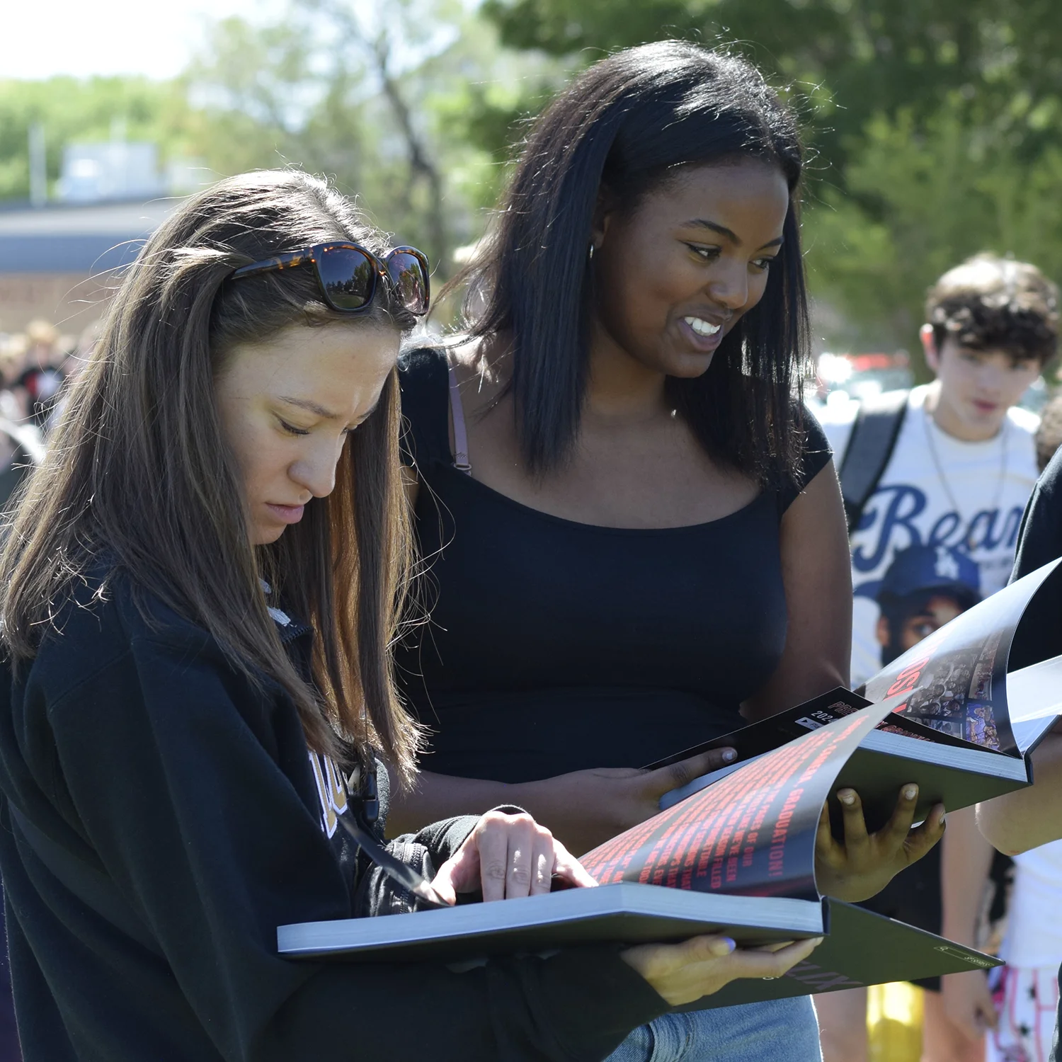 Yearbook Day  On Yearbook Day, every student receives a yearbook and enjoys food and outdoor fun while they peruse the publication and spend time gathering signatures from friends and faculty.
