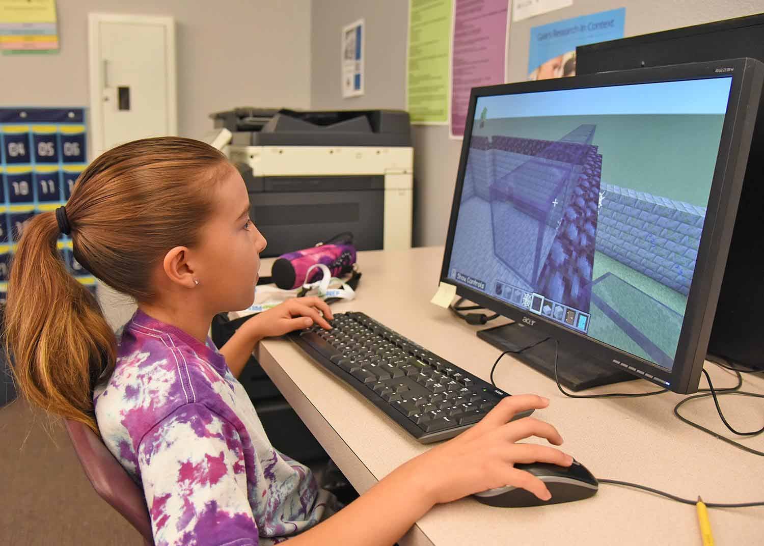 Young camper on computer 