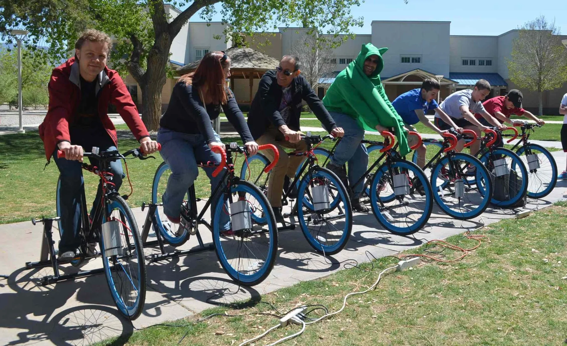 Dr. Chuck Buxbaum on bikes formerly  used to generate electricity in the Russell Student Center.