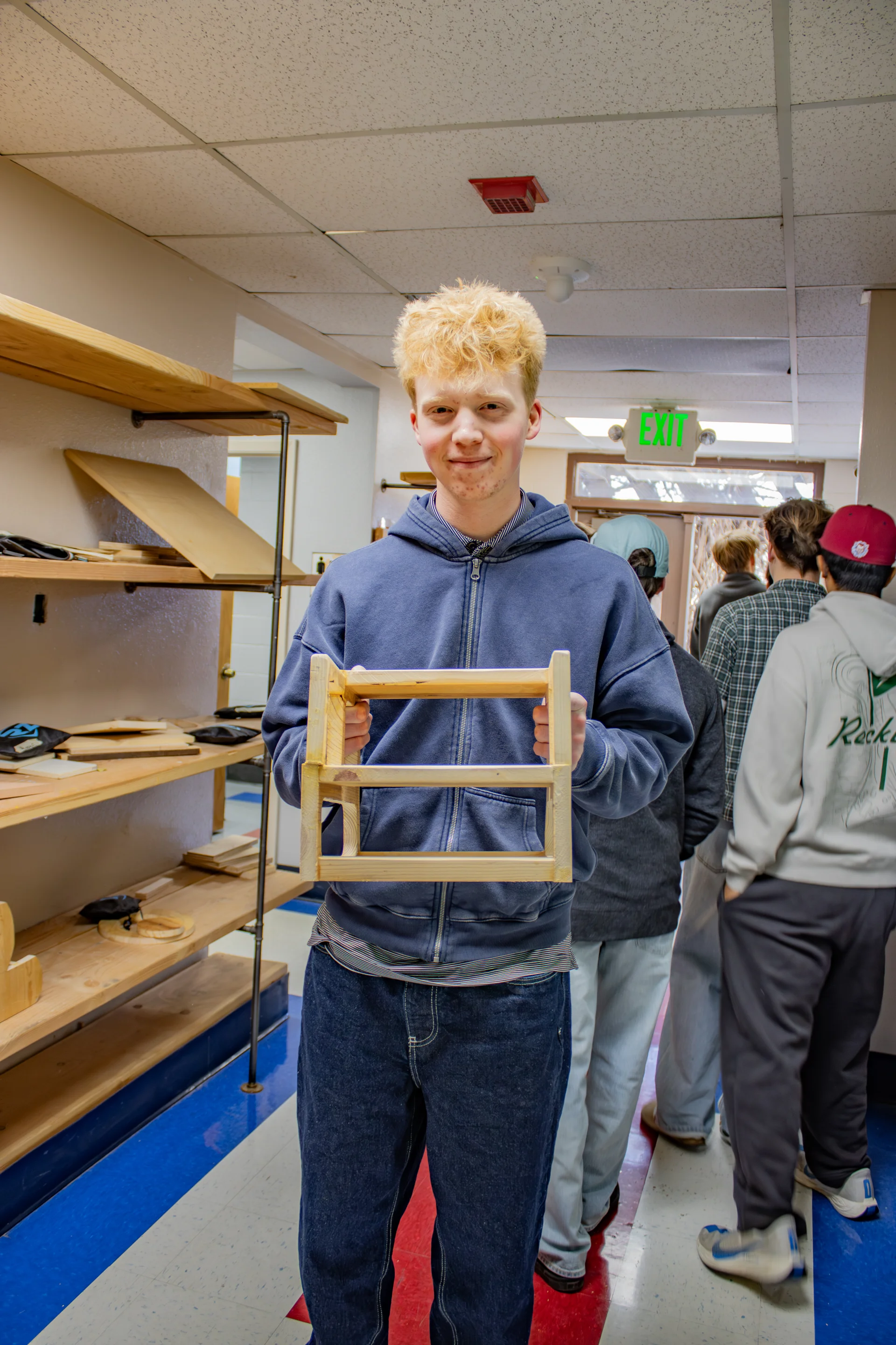 Student displays the step stool he created