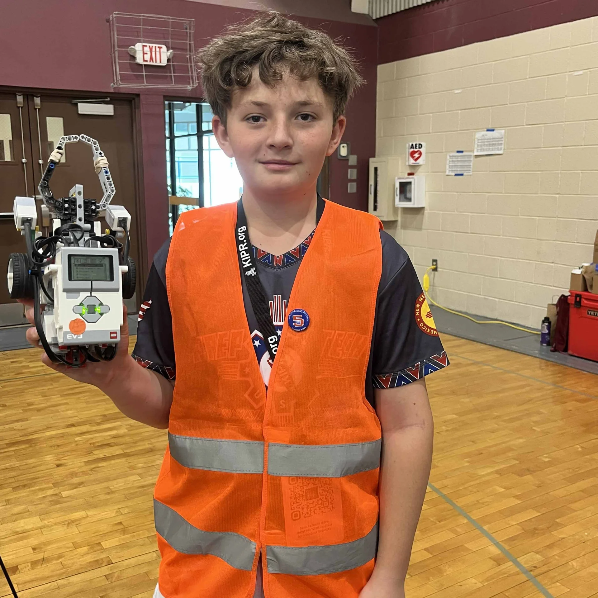 Student holding robot