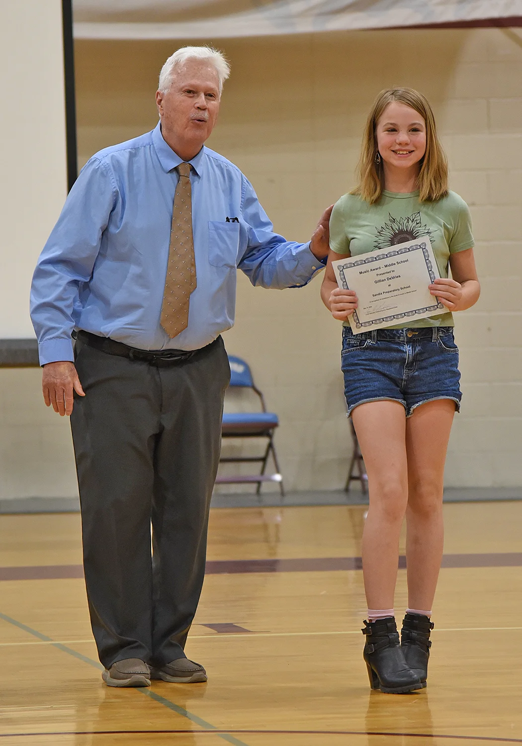 Student receiving award