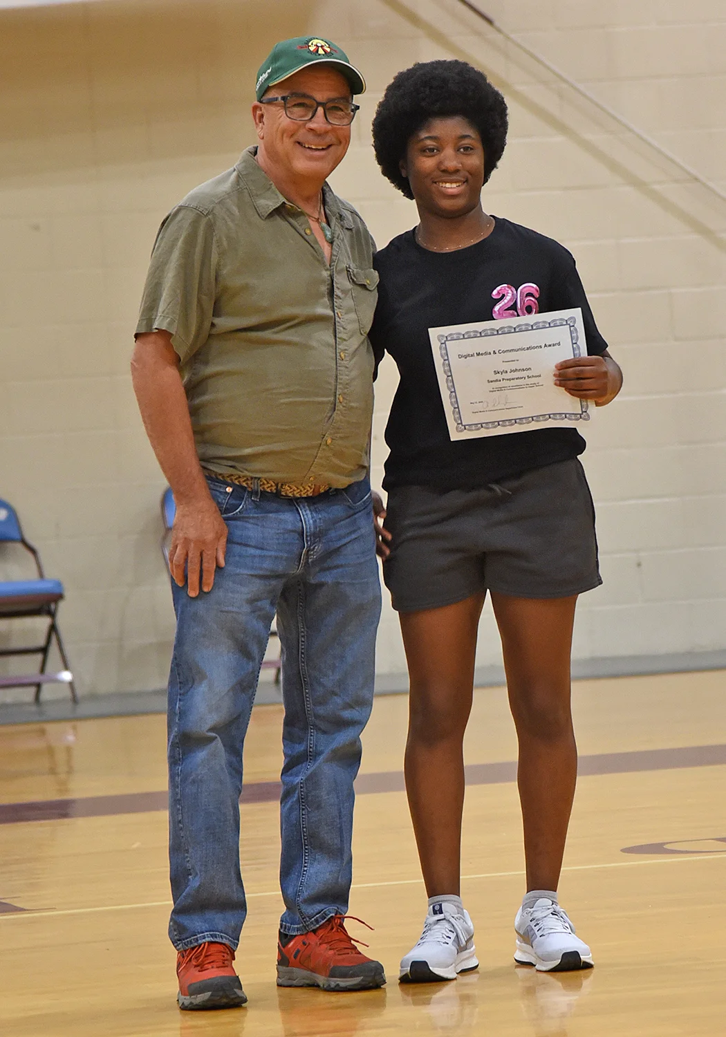 Student receiving award