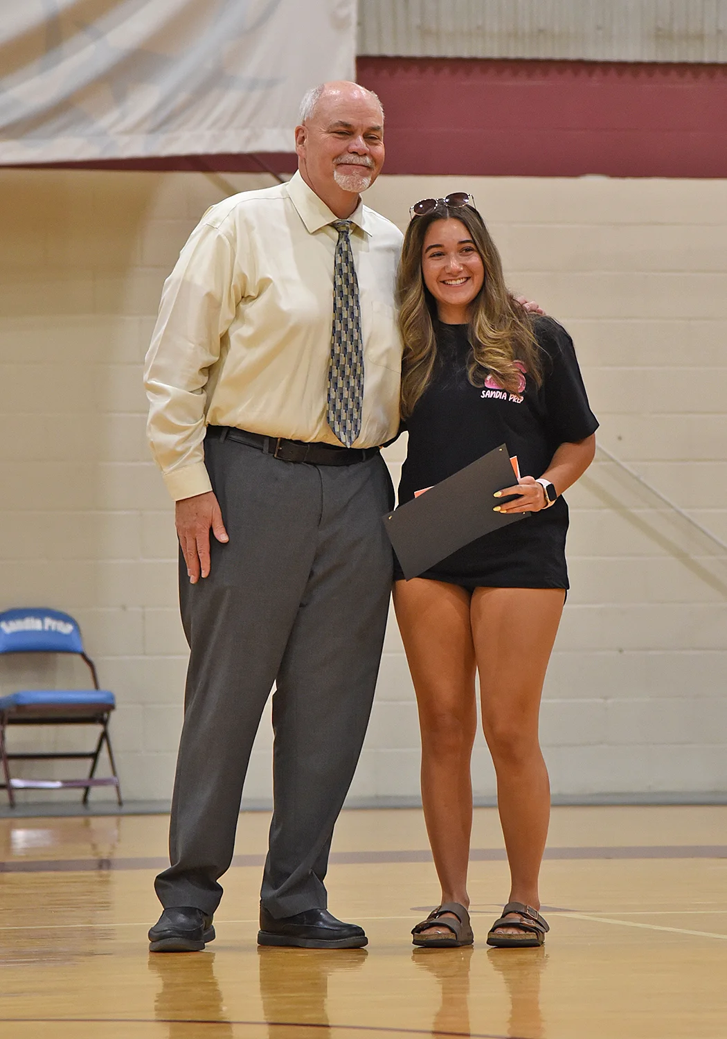 Student receiving award from head of school