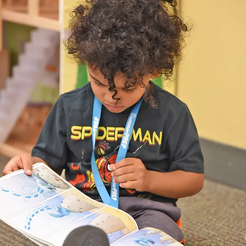 camper looking at book