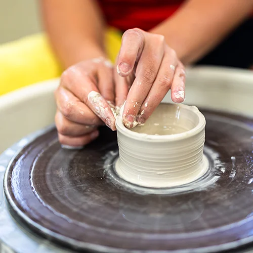 close up of clay on wheel