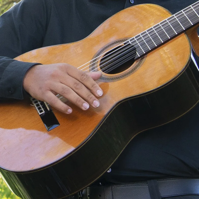 close up of playing guitar