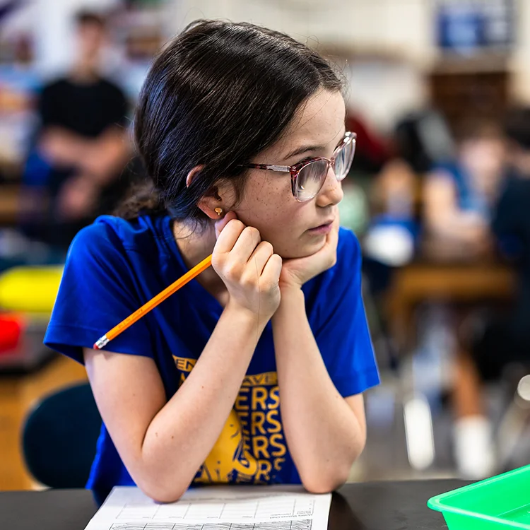 Camper playing attention in class