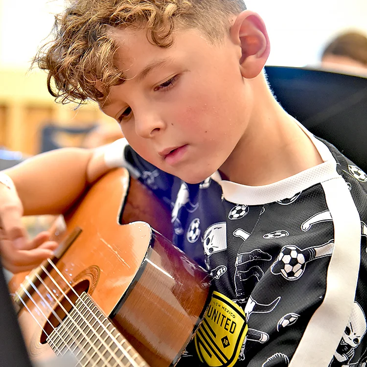 camper playing guitar