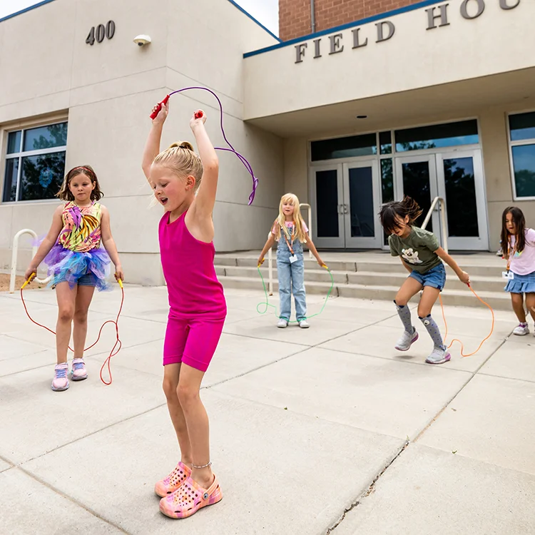 Campers jump roping outside