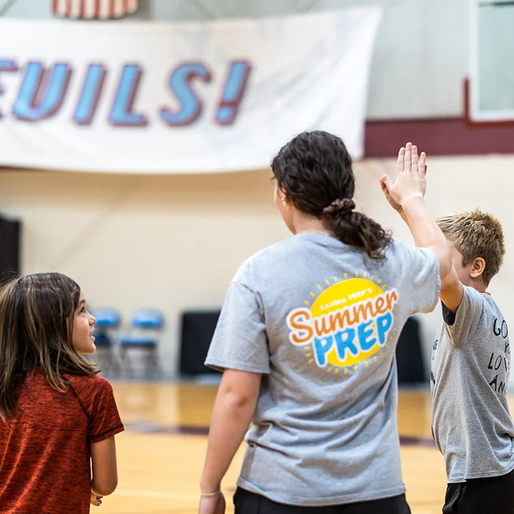 campers high fiving
